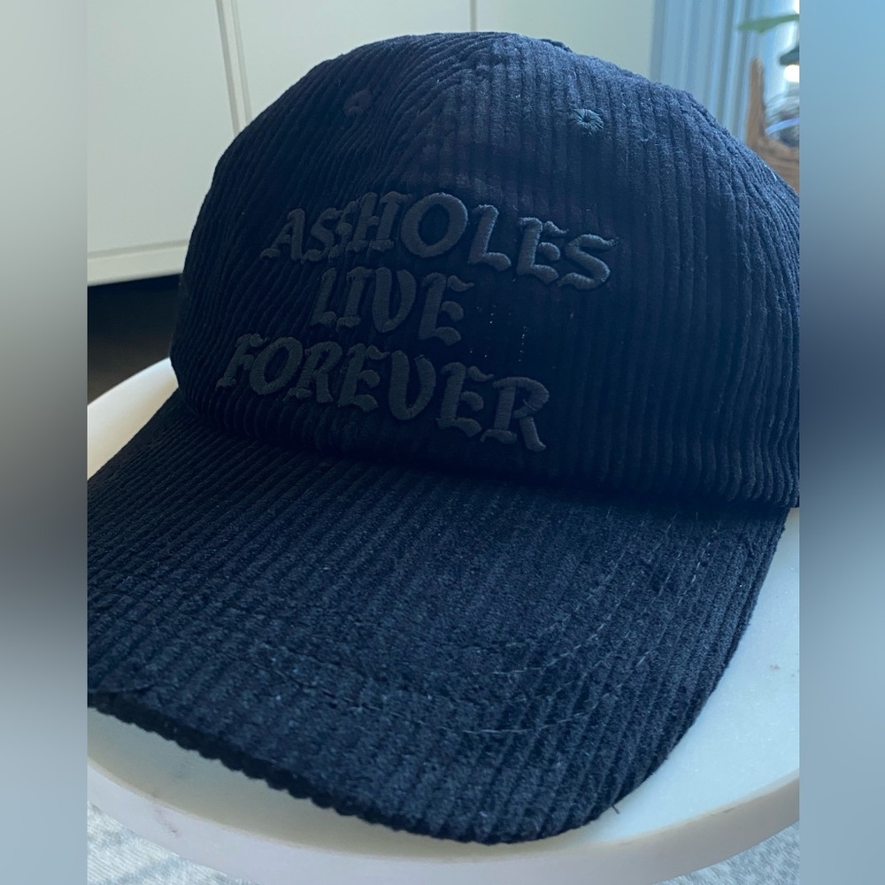 Black corduroy hat, Assholes Live Forever brand